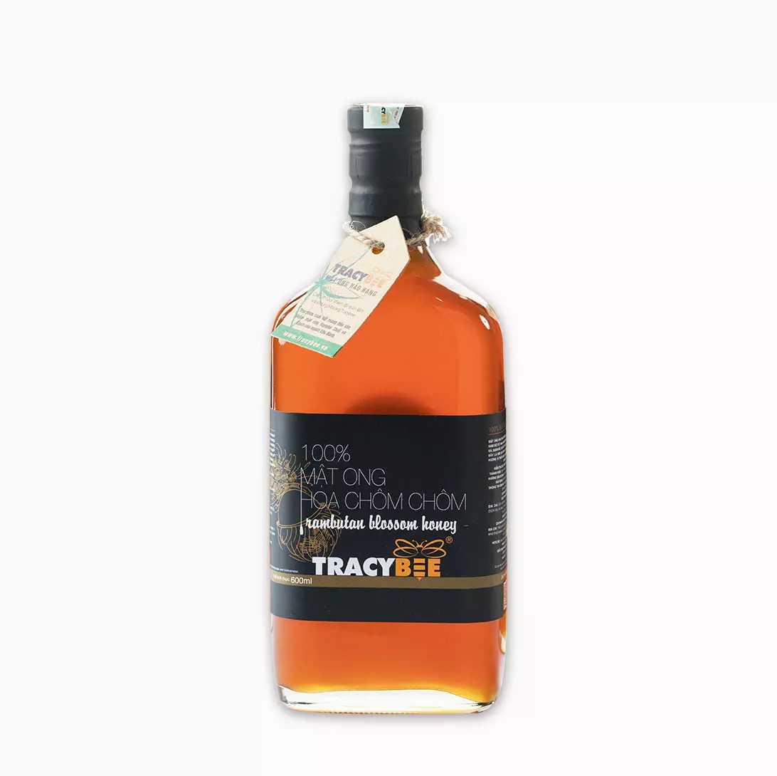 Mat-ong-hoa-chom-chom_600ml.webp Mật ong hoa chôm chôm Tracybee 850g - Image 1